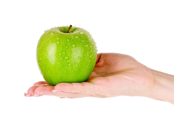 Groene appel op hand geïsoleerd op wit — Stockfoto