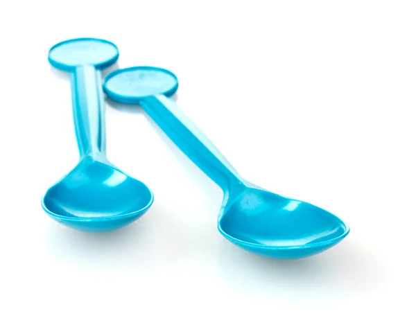 Blue plastic spoons — Stock Photo, Image