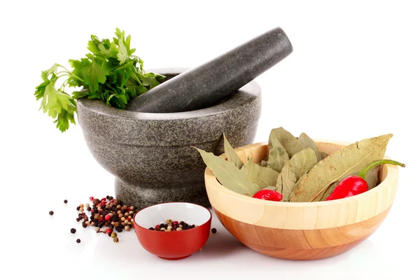Mortar and pestle, parsley, bay leaf and pepper isolated on whit — Stock Photo, Image