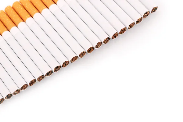 Molte sigarette isolate su bianco — Foto Stock
