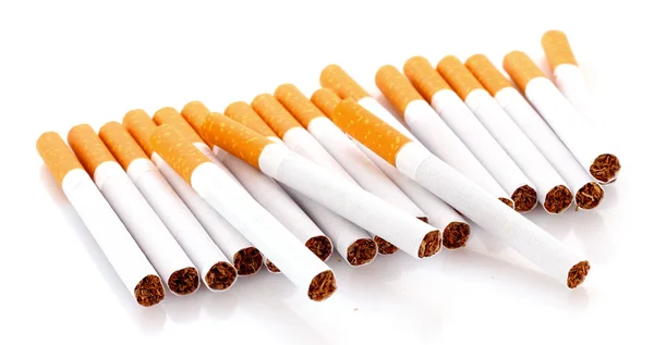 Muchos cigarrillos aislados en blanco —  Fotos de Stock