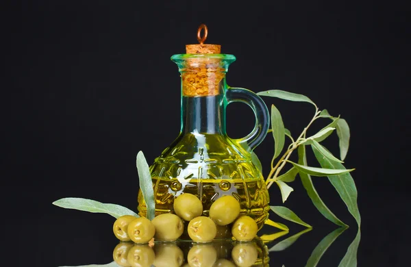 Olive oil in jar and olives — Stock Photo, Image