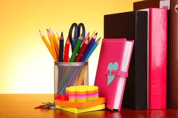 Stationery and books on red background — Stock Photo, Image
