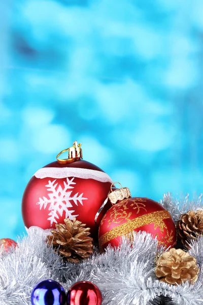 Beautiful Christmas ball, cones and tinsel — Stock Photo, Image