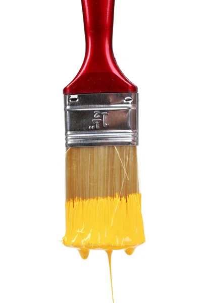 Escova com tinta amarela brilhante — Fotografia de Stock