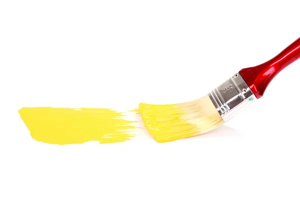 Brush with bright yellow paint — Stock Photo, Image