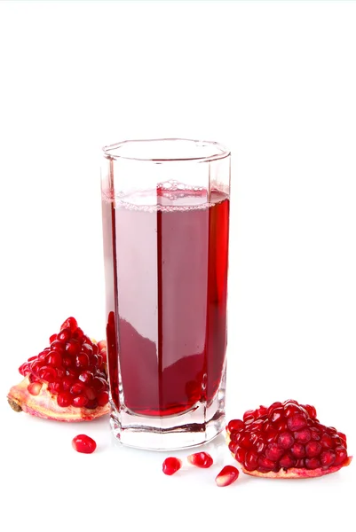 Sliced pomergranate and glass of juice isolated on white — Stock Photo, Image