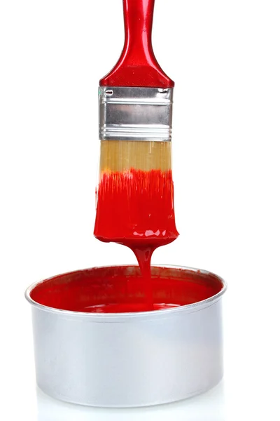 Open can of red paint and brush — Stock Photo, Image