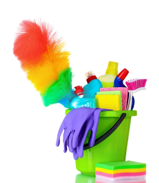 Detergent bottles, brushes and gloves in bucket — Stock Photo, Image