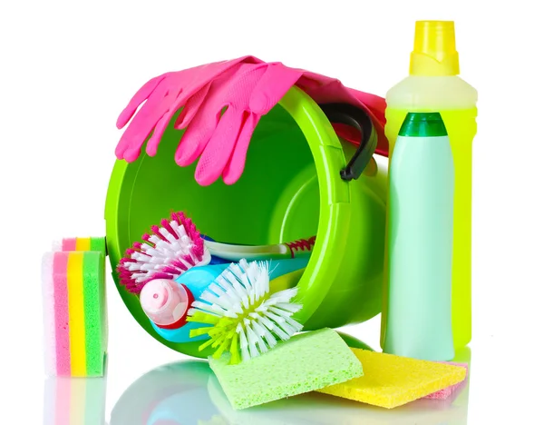 Detergent bottles, brushes, gloves and sponges in bucket — Stock Photo, Image