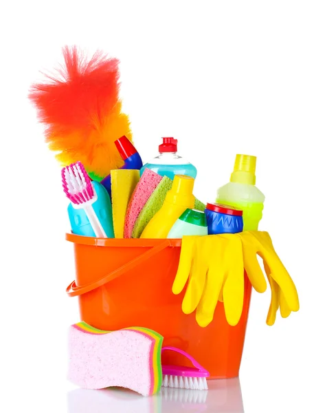 Detergent bottles, brushes, gloves and sponges in bucket — Stock Photo, Image