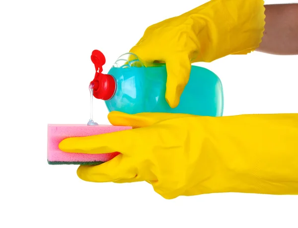 Detergent bottle and sponge in hands — Stock Photo, Image