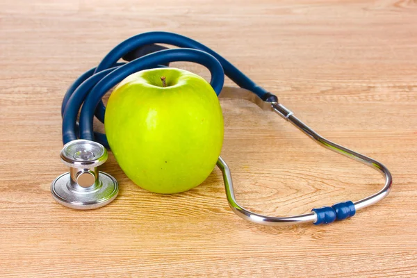 Medical stethoscope and apple — Stock Photo, Image