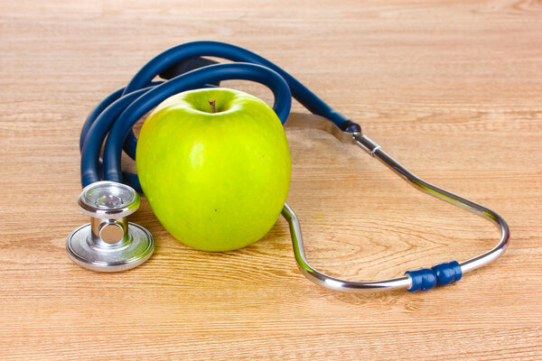Medical stethoscope and apple
