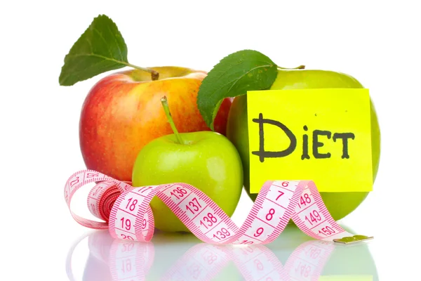Concept of a diet. Many fresh ripe apples with measuring tape — Stock Photo, Image
