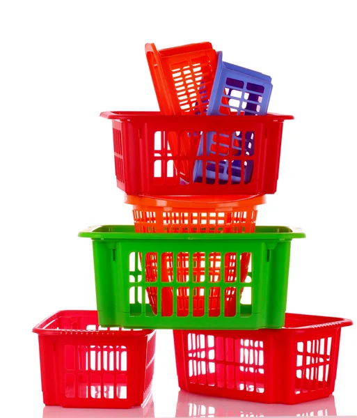 Diferentes cestas de plástico aisladas en blanco — Foto de Stock