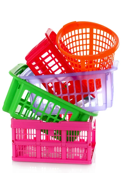 Diferentes cestas de plástico aisladas en blanco — Foto de Stock