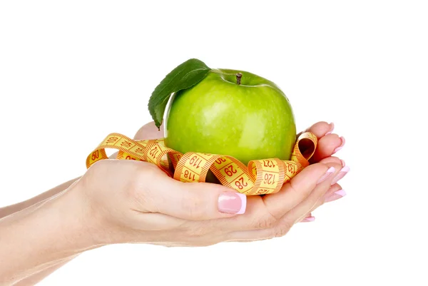 Kobieta ręcznie z jabłkiem i taśma pomiarowa — Zdjęcie stockowe