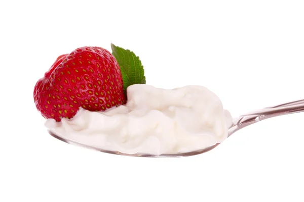 Strawberry in spoon with cream isolated on white — Stock Photo, Image