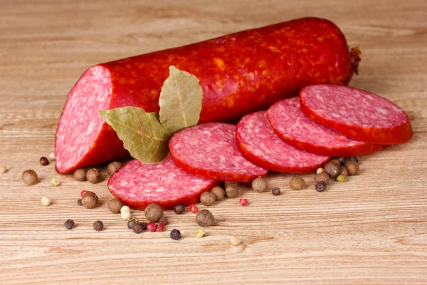 Tasty sausage and spices — Stock Photo, Image