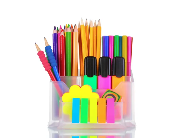 Яркие ручки, карандаши и ластики в держателе — стоковое фото