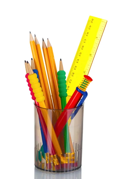 Bright pencils, pen and ruler in holder — Stock Photo, Image