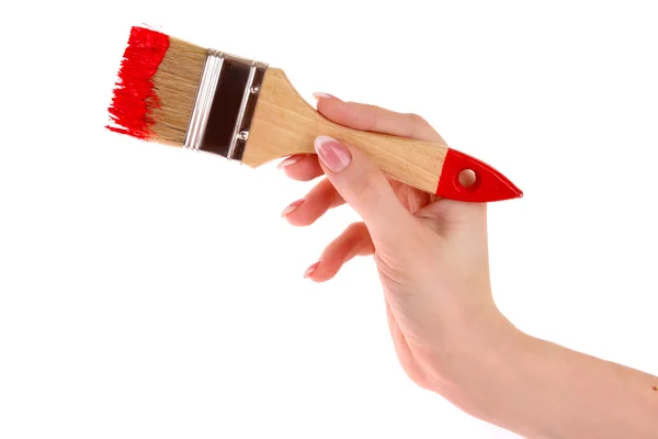 Hand med pensel och röd färg isolerad på vit — Stockfoto