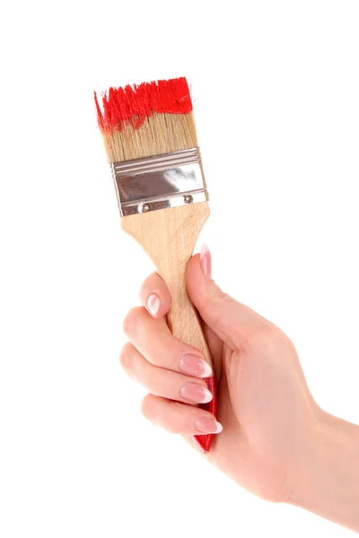 Mão com pincel e tinta vermelha isolada sobre branco — Fotografia de Stock