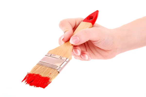 Mano con pincel y pintura roja aislada en blanco — Foto de Stock