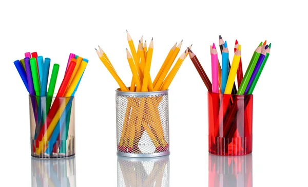 Bright markers and crayons in holders — Stock Photo, Image