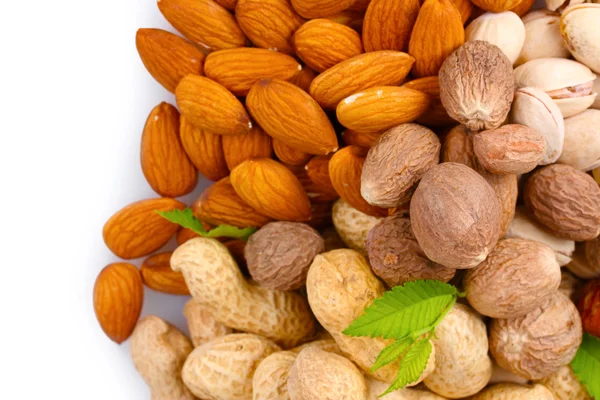 Almonds, nutmeg, peanuts and pistachios — Stock Photo, Image