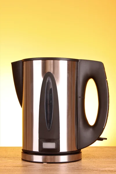 Electric kettle on blue background — Stock Photo, Image