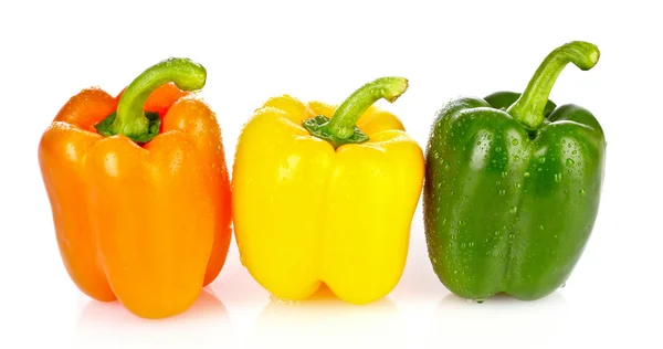 Tři červené papriky izolované na bílém — Stock fotografie