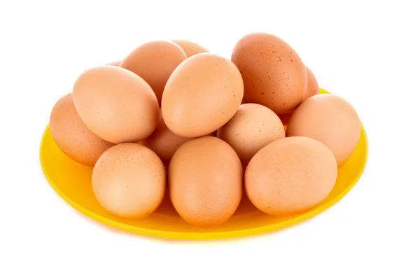 Eggs in plate isolated on white — Stock Photo, Image