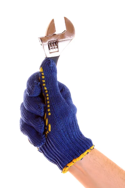 Skiftnyckel i handen med skydd handske isolerad på vit — Stockfoto