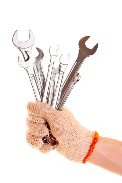 Skiftnyckel i handen med skydd handske isolerad på vit — Stockfoto