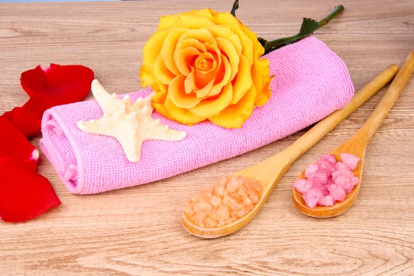 Rose petals, soap, bath salt and towel — Stock Photo, Image