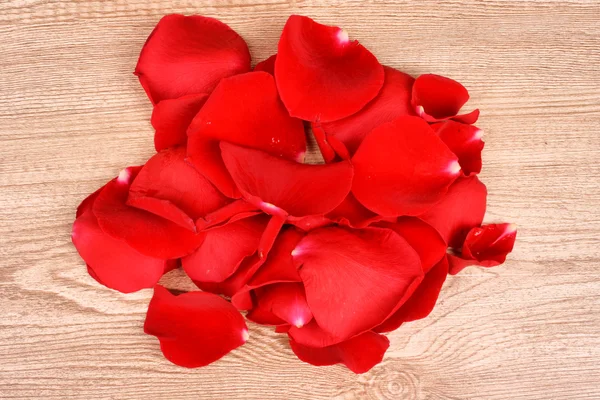 Rose petals on wooden background — Stock Photo, Image