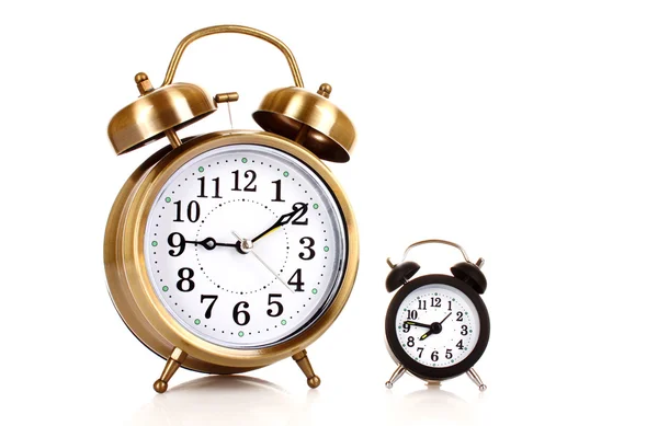 Dois relógios com diferentes tempos isolados em branco — Fotografia de Stock