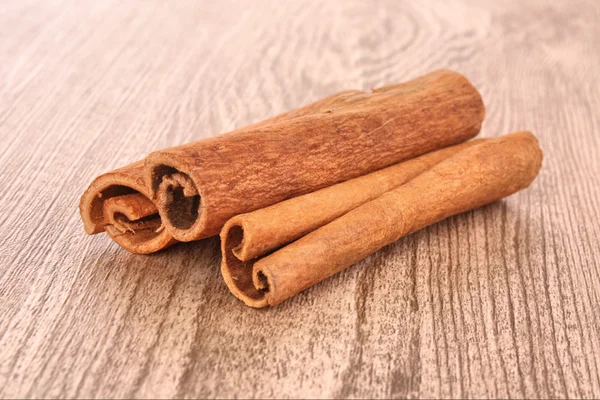 Cinnamon bark on wooden table — Stock Photo, Image