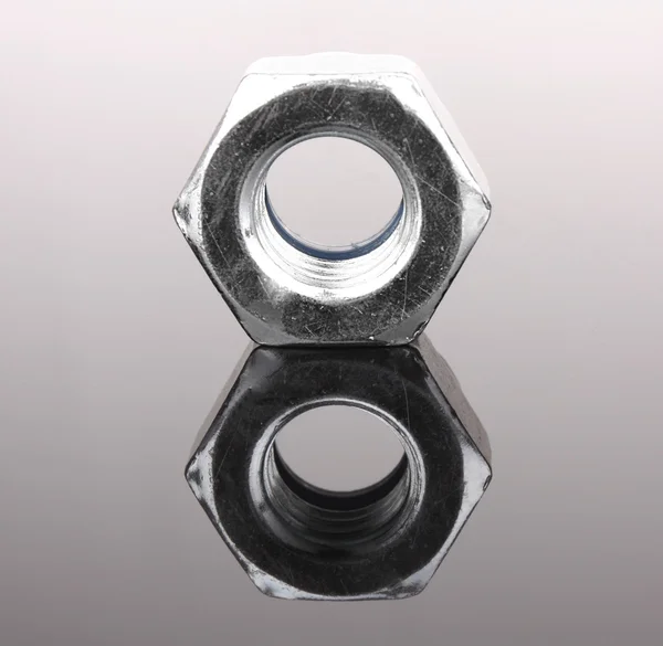 Bolt with reflection on grey background — Stock Photo, Image