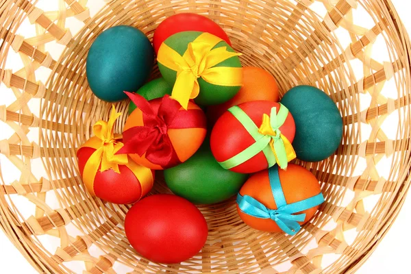 Easter eggs in basket isolated on white — Stock Photo, Image