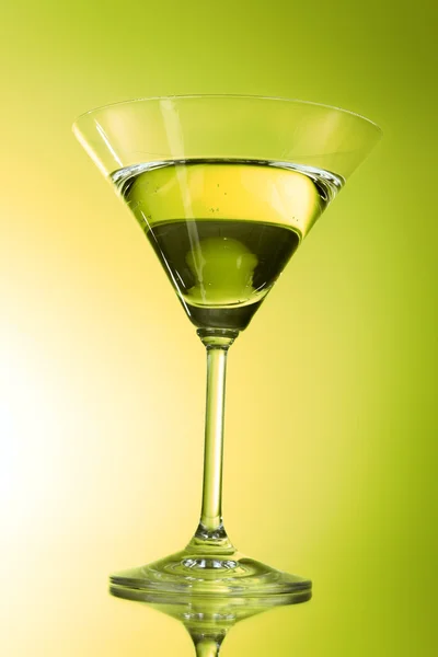 Martini glass on green background — Stock Photo, Image