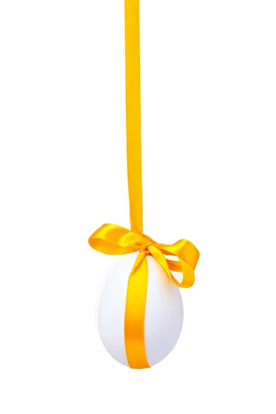 Egg with a yellow bow — Stock Photo, Image