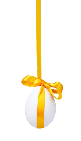 Egg with a yellow bow — Stock Photo, Image