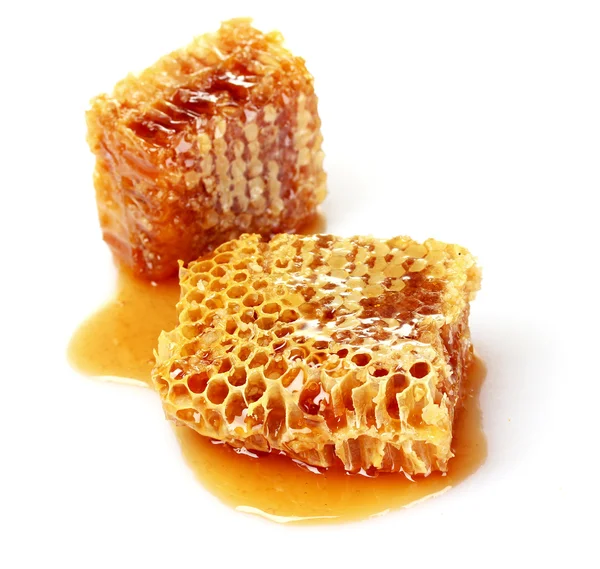 Pentes com mel isolado em branco — Fotografia de Stock