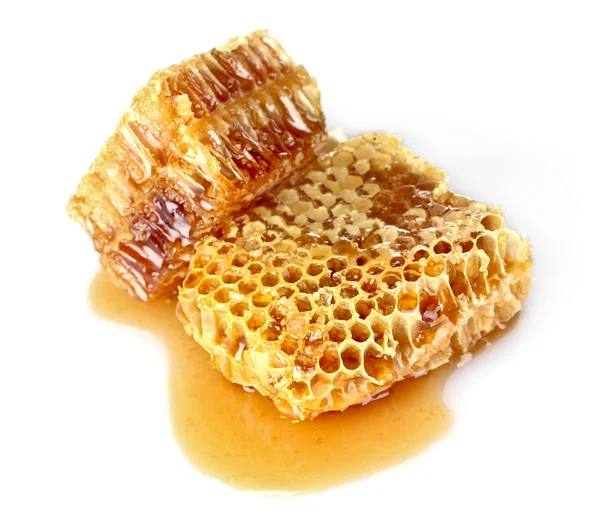Pentes com mel isolado em branco — Fotografia de Stock