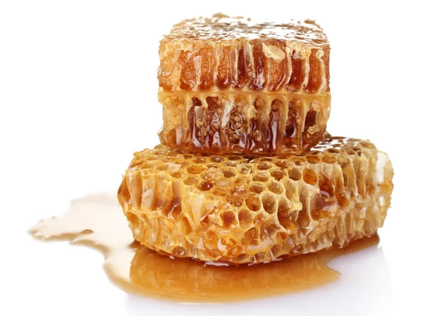 Гребінці з медом ізольовані на білому — стокове фото