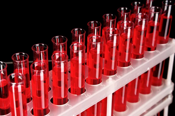 Test-tubes on black background — Stock Photo, Image