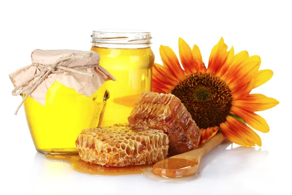 Krásné hřebeny, medu, lžíce a slunečnice — Stock fotografie